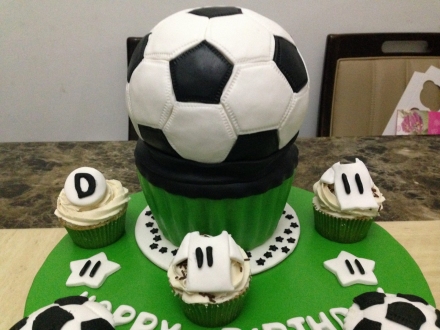 Football themed fondant cake. Good for a boy or a club birthday celebration