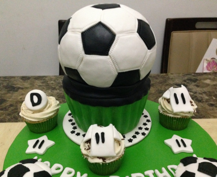 Football themed fondant cake. Good for a boy or a club birthday celebration
