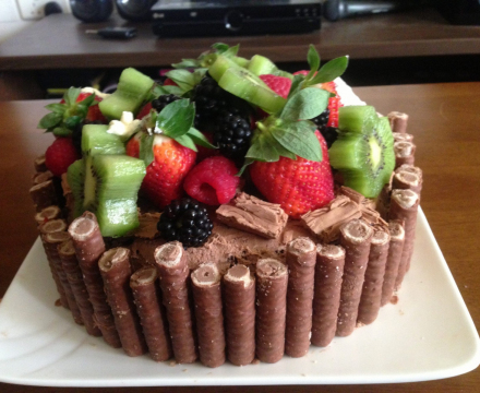 Freshly baked cake decorated with fresh fruit cake