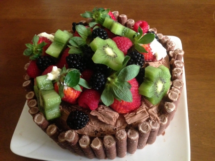 Freshly baked cake decorated with fresh fruit cake