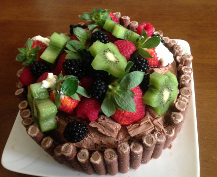 Freshly baked cake decorated with fresh fruit cake