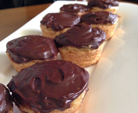 Short bread cups with dulce de leche and ganache.