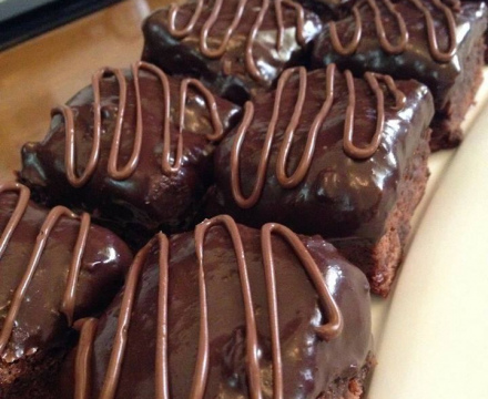 Chocolate brownies covered with ganache